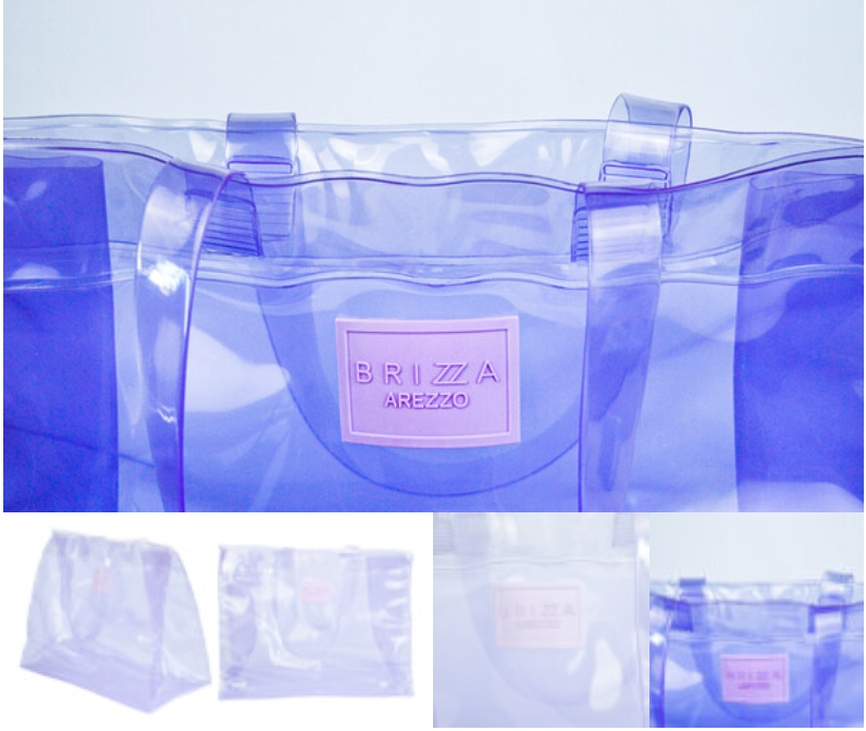 Bolso transparente de PVC cristal en tonos azules y violetas, con detalles de la pieza